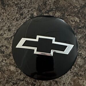 Black Chevrolet hub cap